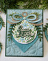 Handmade greeting card with ornament on it and peace on earth sentiment on it.