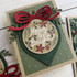 Handmade greeting card with ornament on it and Merry & Bright sentiment on it.