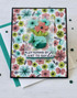 Handmade greeting card with flowers on it and a butterflies and fluttering by just to say hi sentiment on it.