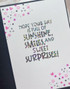 Inside of a handmade greeting card with hope your day is full of sunshine, smiles and sweet surprises sentiment on it.