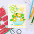 Handmade greeting card with a basket of flowers and sharing joy with you sentiment on it.