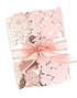 Handmade greeting card with flowers on it and a bow.