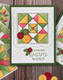 Handmade greeting card with quilt on it and sending warm wishes sentiment on it.
