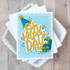 Handmade greeting card with presents and party hat on it and oh happy day sentiment on it.