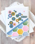 Handmade greeting card with hexagons on it and hello sentiment on it.