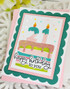 Handmade greeting card with cake on it and happy birthday to you sentiment on it.