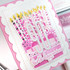 Handmade greeting card with cake on it and birthday wishes sentiment on it.