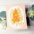 Handmade greeting card with flowers on it and thinking of you sentiment on it.