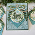 Handmade greeting card with ornament on it and peace on earth sentiment on it.