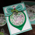 Handmade greeting card with ornament on it and happy holidays sentiment on it.