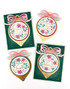 Four handmade greeting cards with ornaments on each and different holiday sentiments on each of them.