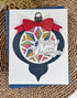 Handmade greeting card with ornament on it and merry Christmas sentiment on it.