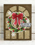 Handmade greeting card with wreath on it and season's greetings sentiment on it.