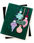 Handmade greeting card with ornaments on it and season's greetings sentiment on it.