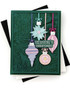 Handmade greeting card with ornaments on it and season's greetings sentiment on it.