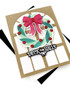 Handmade greeting card with wreath on it and deck the halls sentiment on it.