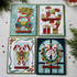 Four handmade greeting cards with various holiday sentiments and icons on each.