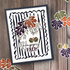Handmade fall greeting card featuring a bold black and white scalloped frame, colorful autumn leaves, and a Happy Fall sentiment.