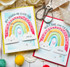 Two handmade greeting cards with rainbows on each .