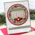 Handmade greeting card with a wreath on it that says Merry and from our house to yours, wishing you a joyous holiday sentiment on it.