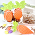 Handmade treat boxes that are shaped like carrots for gift giving.