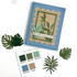 Handmade greeting card with flowers on it and may peace surround you sentiment on it with flowers in background.