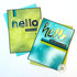Two handmade greeting cards with hello on both of them and one with sending hugs sentiment and the other with you are so loved sentiment on it.