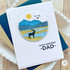 Handmade greeting card with a deer on it and mountains with happy birthday dad sentiment on it.