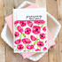 Handmade greeting card with flowers on it and praying for you sentiment on it with cardstock in background.