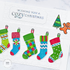 Handmade greeting card with stockings on it and wishing you a cozy christmas sentiment on it.