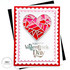Handmade greeting card with heart on it and happy valentine's day sentiment on it with cardstock in background.