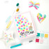 Handmade greeting card with paint brush on it and love you with all my art sentiment on it with crafting materials in background.