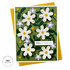 Handmade greeting card with flowers on it and hello friend sentiment on it with cardstock in background.