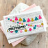 Handmade greeting card with colorful garland and time to celebrate sentiment with cards in the background.