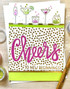 Handmade greeting card with drinks on it and cheers to new beginnings sentiment on it.