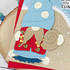 Up close of a greeting card with a scuba gnome on it holding a shell.