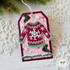 Handmade greeting tag with a sweater on it and warm winter wishes sentiment on it.