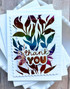 Handmade greeting card with colorful leaves on it and thank you sentiment on it.