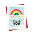 Handmade greeting card of colorful rainbow with thank you sentiment on it with cardstock in background.