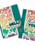 Two handmade greeting cards with hearts on each of them and one has a hello sentiment and the other has a thank you sentiment on it.