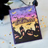 Handmade greeting card with pumpkins and bats on it with happy halloween sentiment on it.