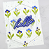 Handmade greeting card with flowers on it and hello sentiment on it.