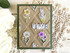 Handmade greeting card with multiple flowers on it and thinking of you sentiment on it.