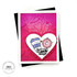 Handmade greeting card with hearts on it and a big heart in the center with love and hugs sentiment with a coffee cup and donut holding a heart in the center with cardstock in background.