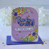 Handmade greeting card with flowers on it and thinking of you on your special day sentiments on it with flowers in background.