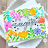 Handmade greeting card with flowers on it and congrats sentiment on it.