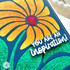 Close up of a handmade greeting card of a flower with you are an inspiration sentiment on it.