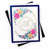Handmade greeting card with a circle and floral around it with get well soon sentiment on it with cardstock in background.