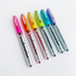 Six Karin markers in Taylor of Taylored Expressions’ signature rainbow colors, arranged in a colorful, eye-catching row