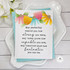 Handmade greeting card with flowers on it and sentiment about strength and capability on it with flowers in background.